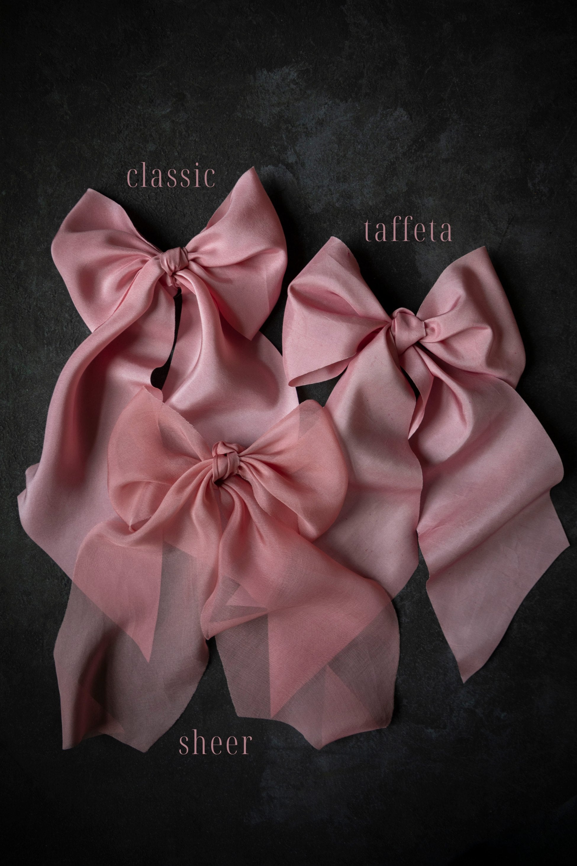 Three pink satin bows labeled 'classic', 'taffeta', and 'sheer' on a dark background.
