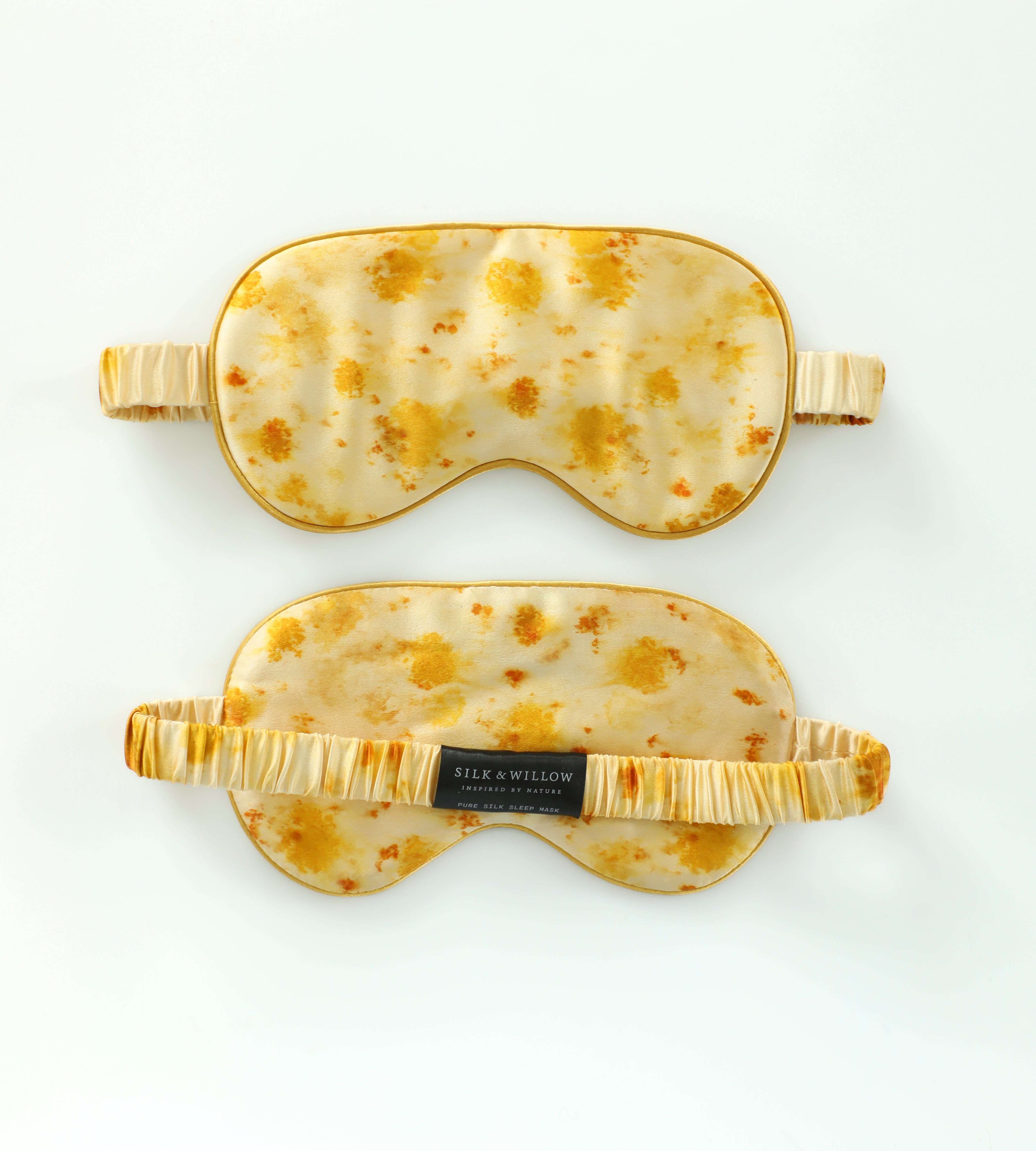 Two sleep masks with a tortoiseshell pattern on a white background