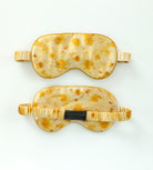 Two sleep masks with a tortoiseshell pattern on a white background