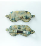 Two marbled eye masks on a white background