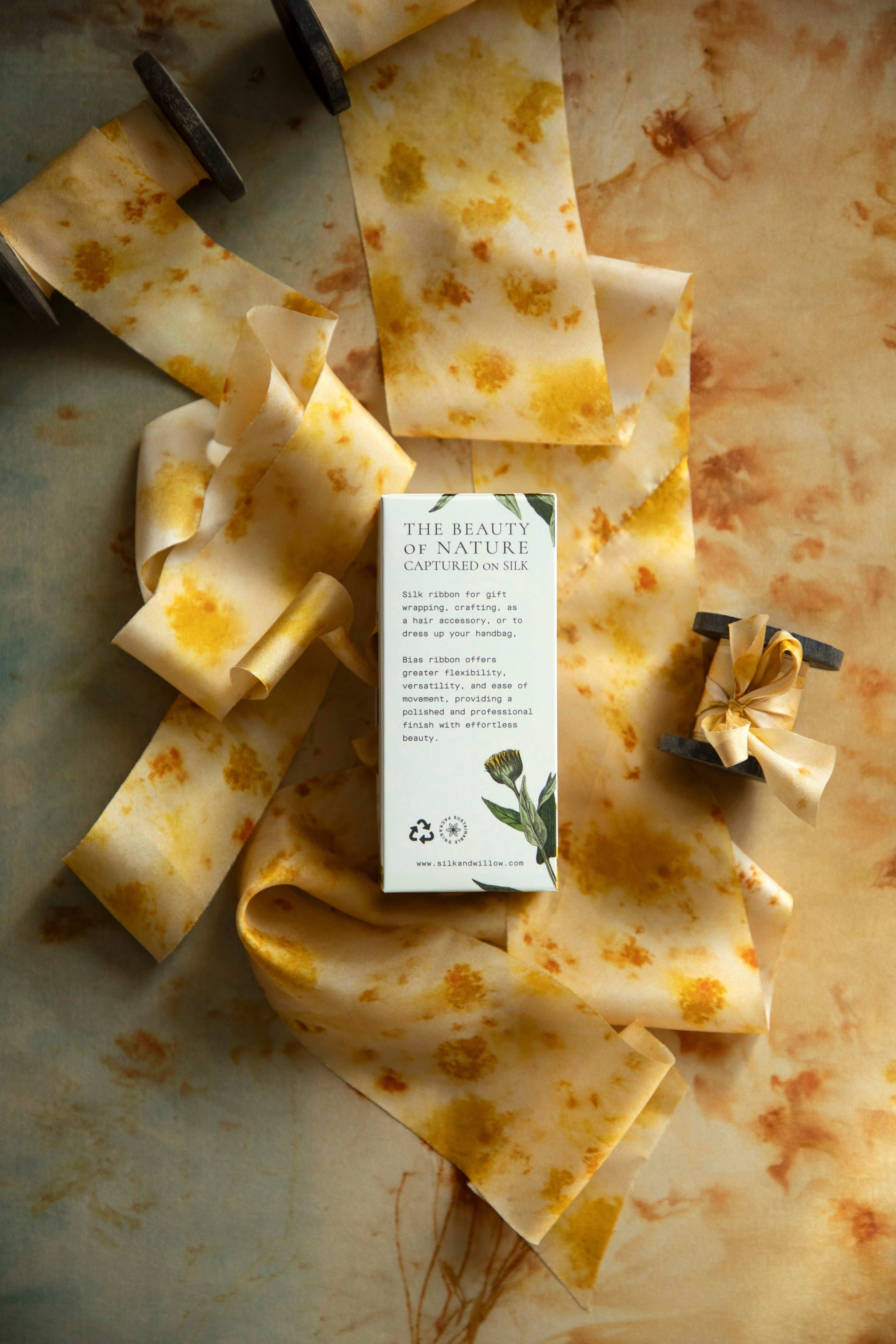 Eco-friendly silk ribbons with nature-inspired patterns, perfect for unique gift wrapping and tying market bouquets, crafted from sustainable materials. 