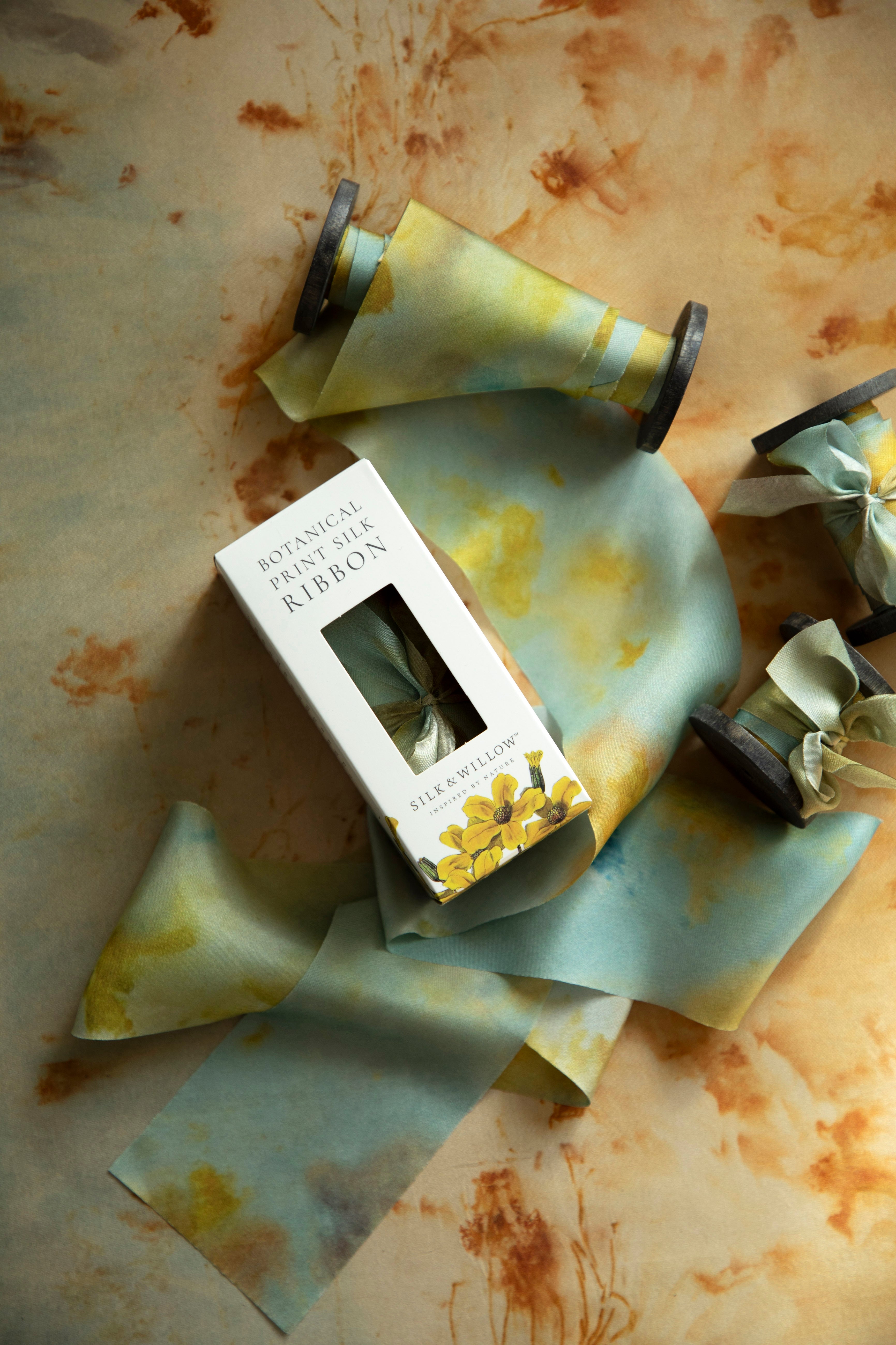 Eco-friendly silk ribbons with nature-inspired patterns, perfect for unique gift wrapping and tying market bouquets, crafted from sustainable materials