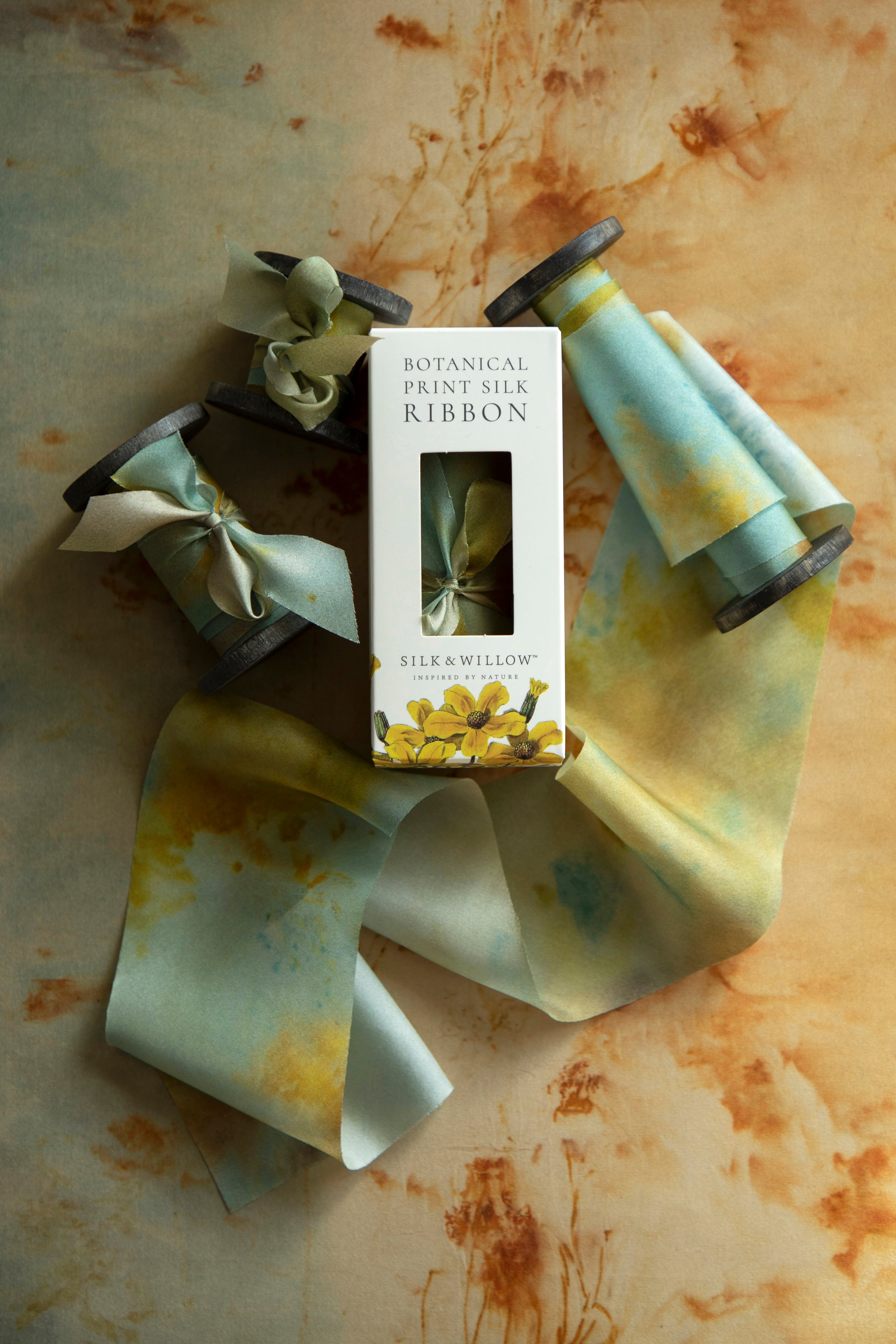 Eco-friendly silk ribbons with nature-inspired patterns, perfect for unique gift wrapping and tying market bouquets, crafted from sustainable materials