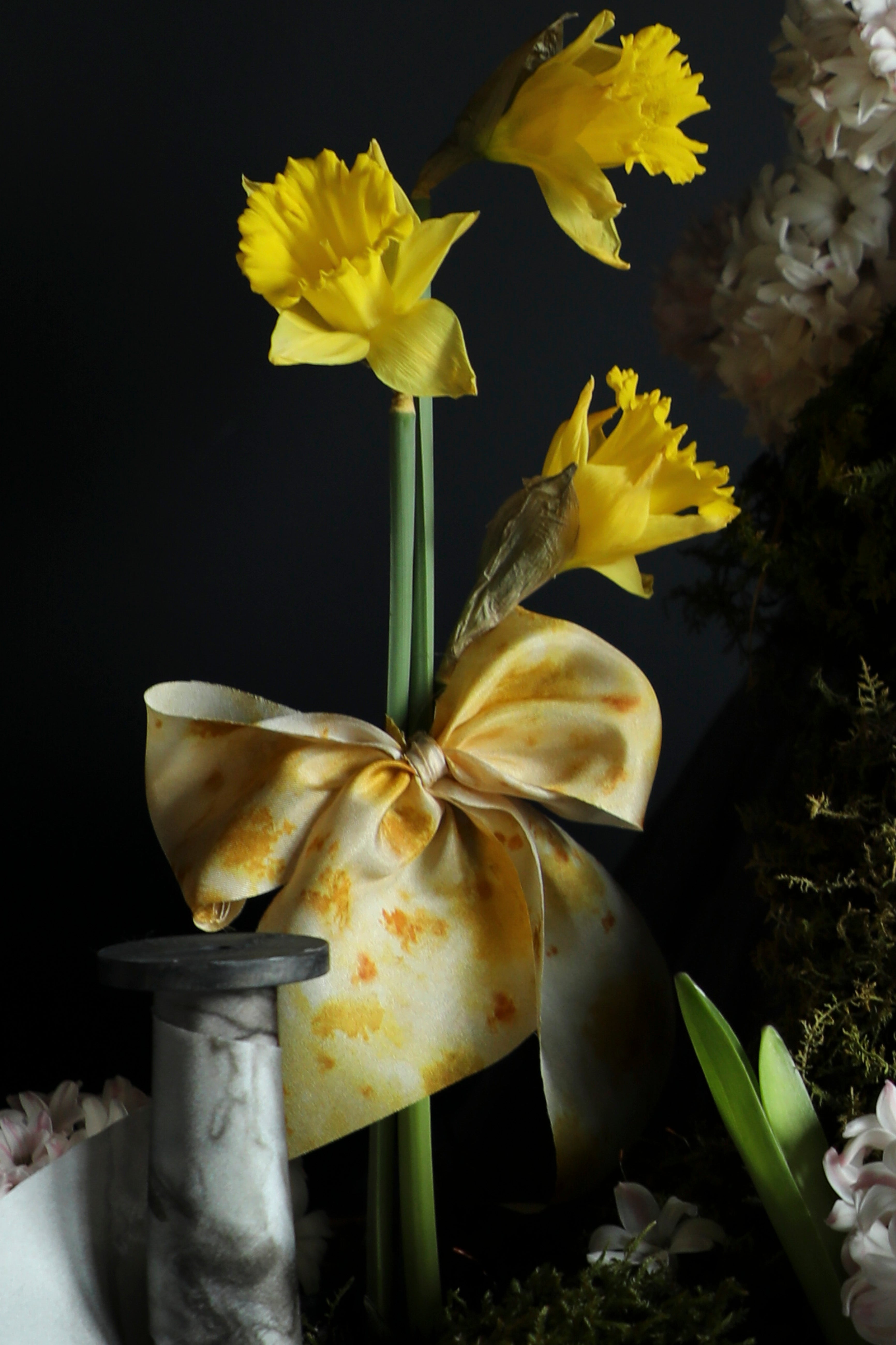 yellow ribbon bow on yellow flowers