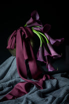 purple calla lily flower arrangement with purple silk ribbon
