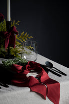 holiday red silk ribbons on plate for holiday dinner table decor