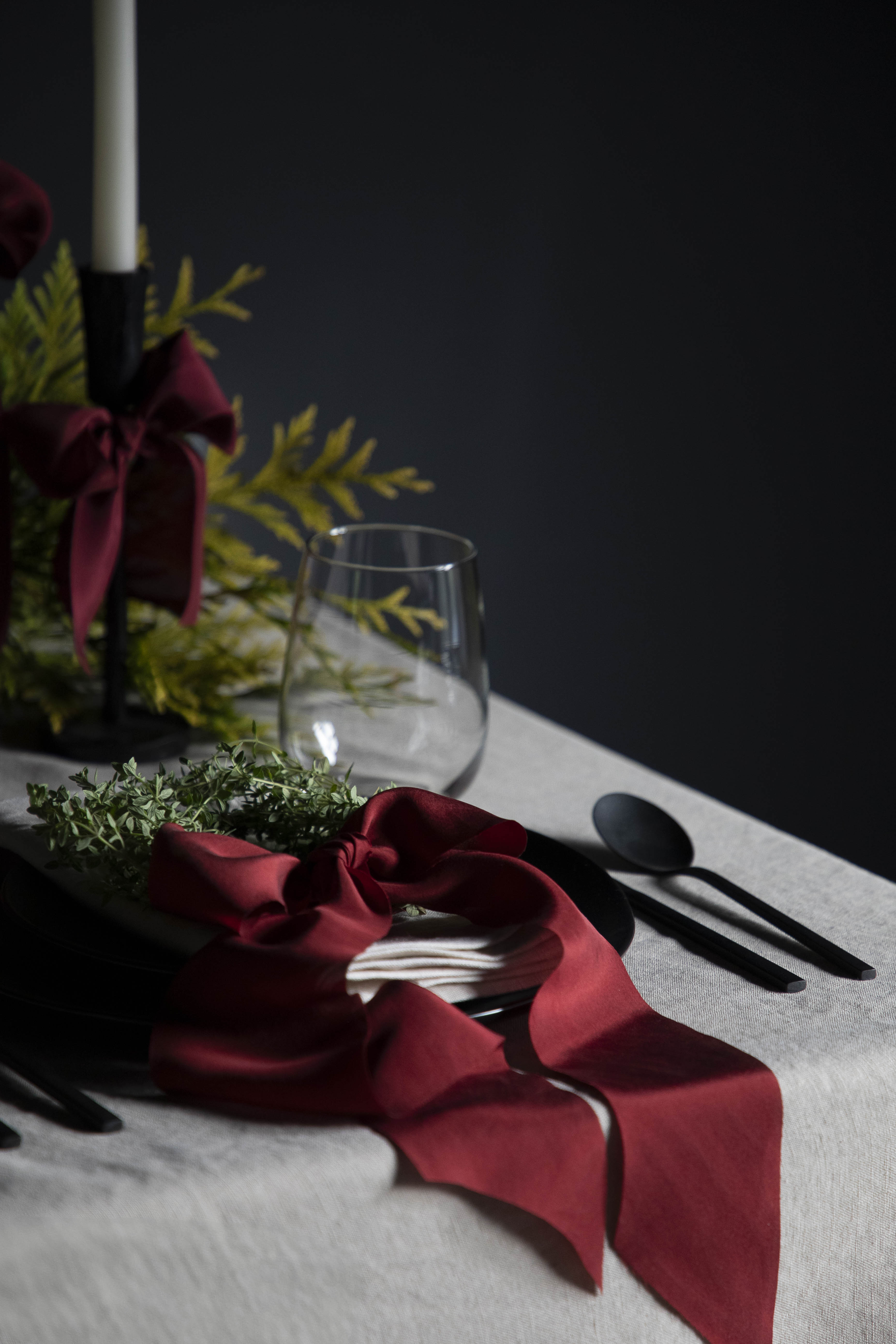 holiday red silk ribbons on plate for holiday dinner table decor