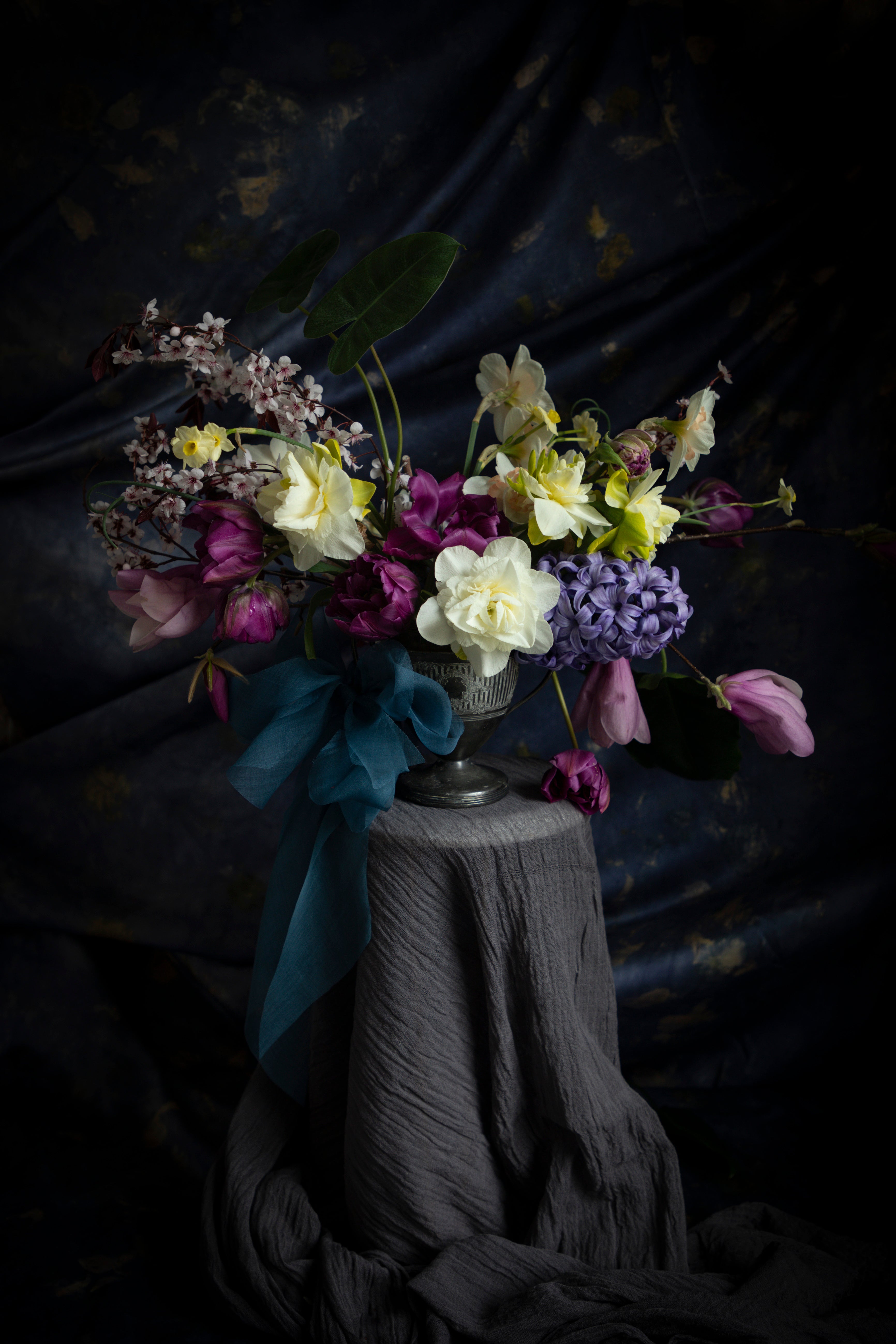 tulip flower arrangement dark moody background