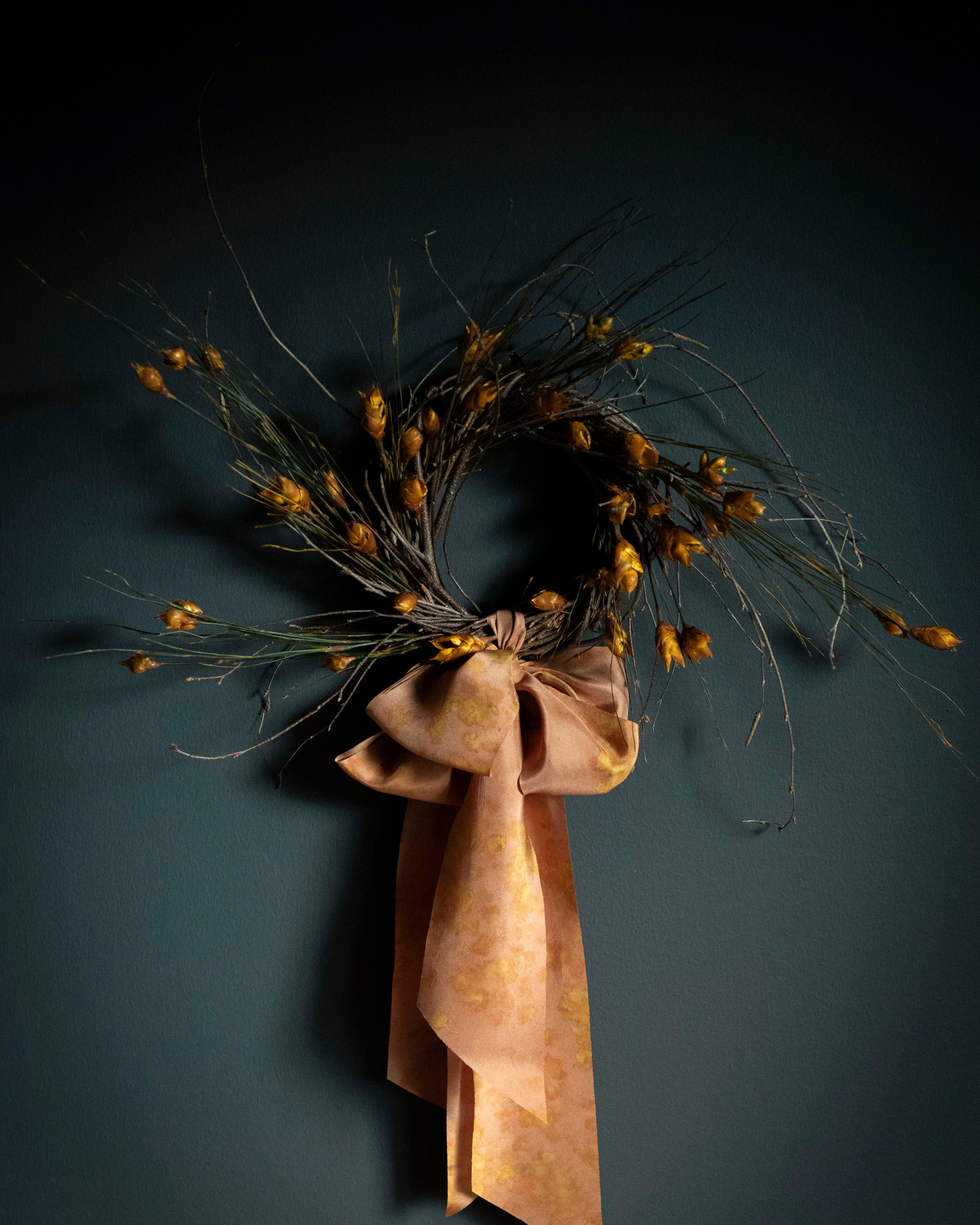 Hand crafted wreath with dried flowers and hand dyed silk ribbon