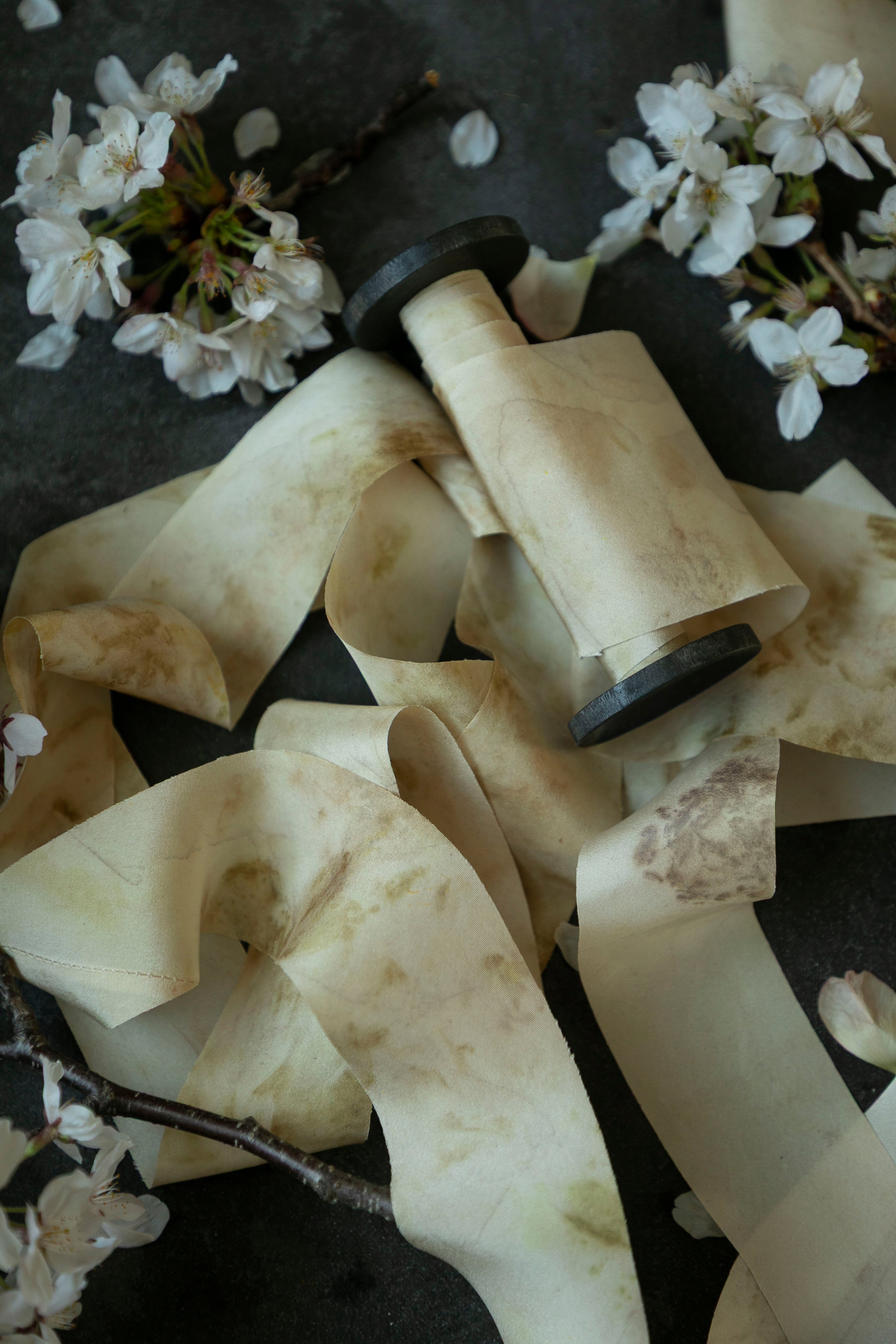 silk ribbon on wood spool with flowers