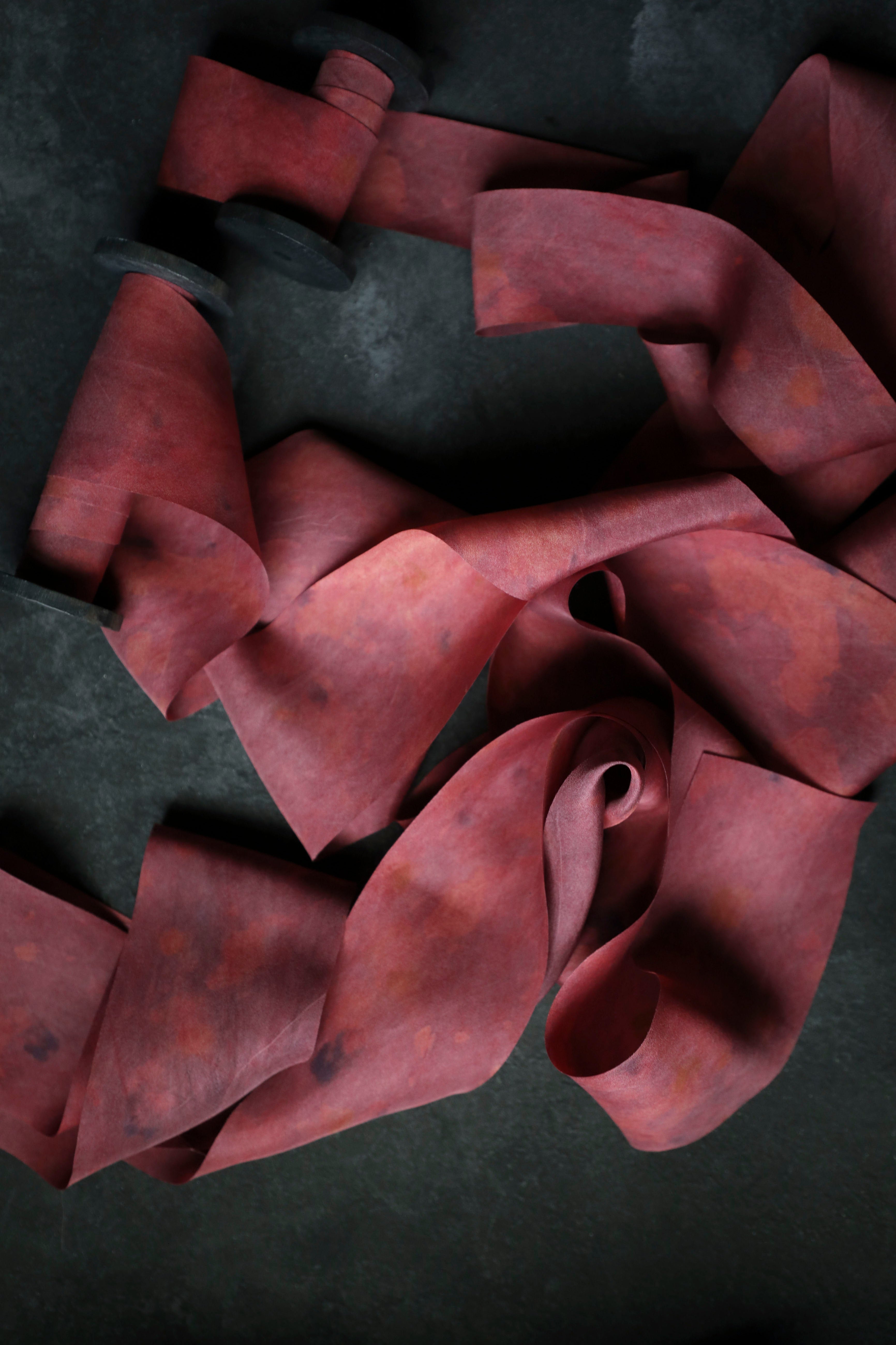 red ribbon on black background