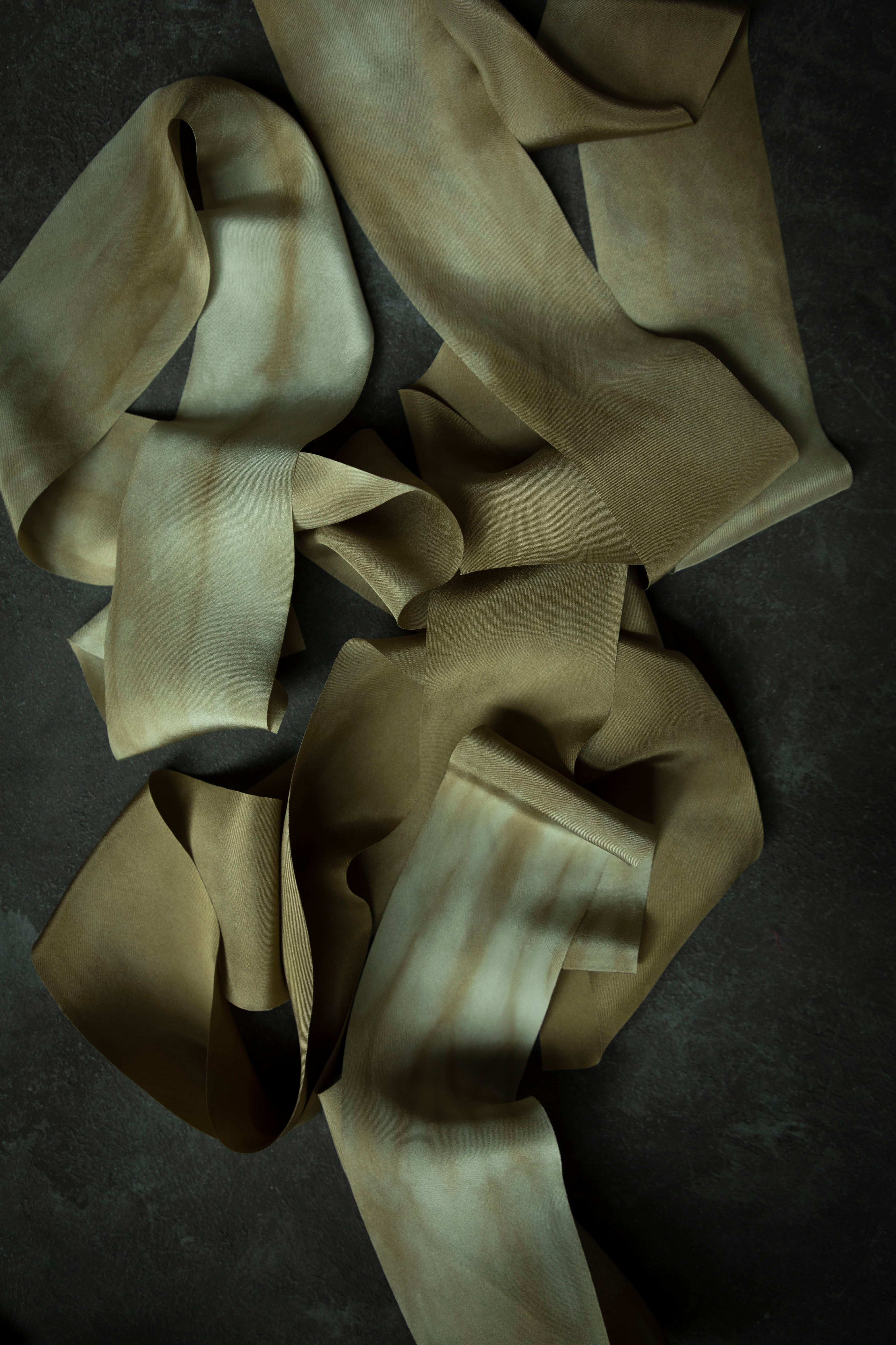 hand dyed silk ribbons on a dark surface