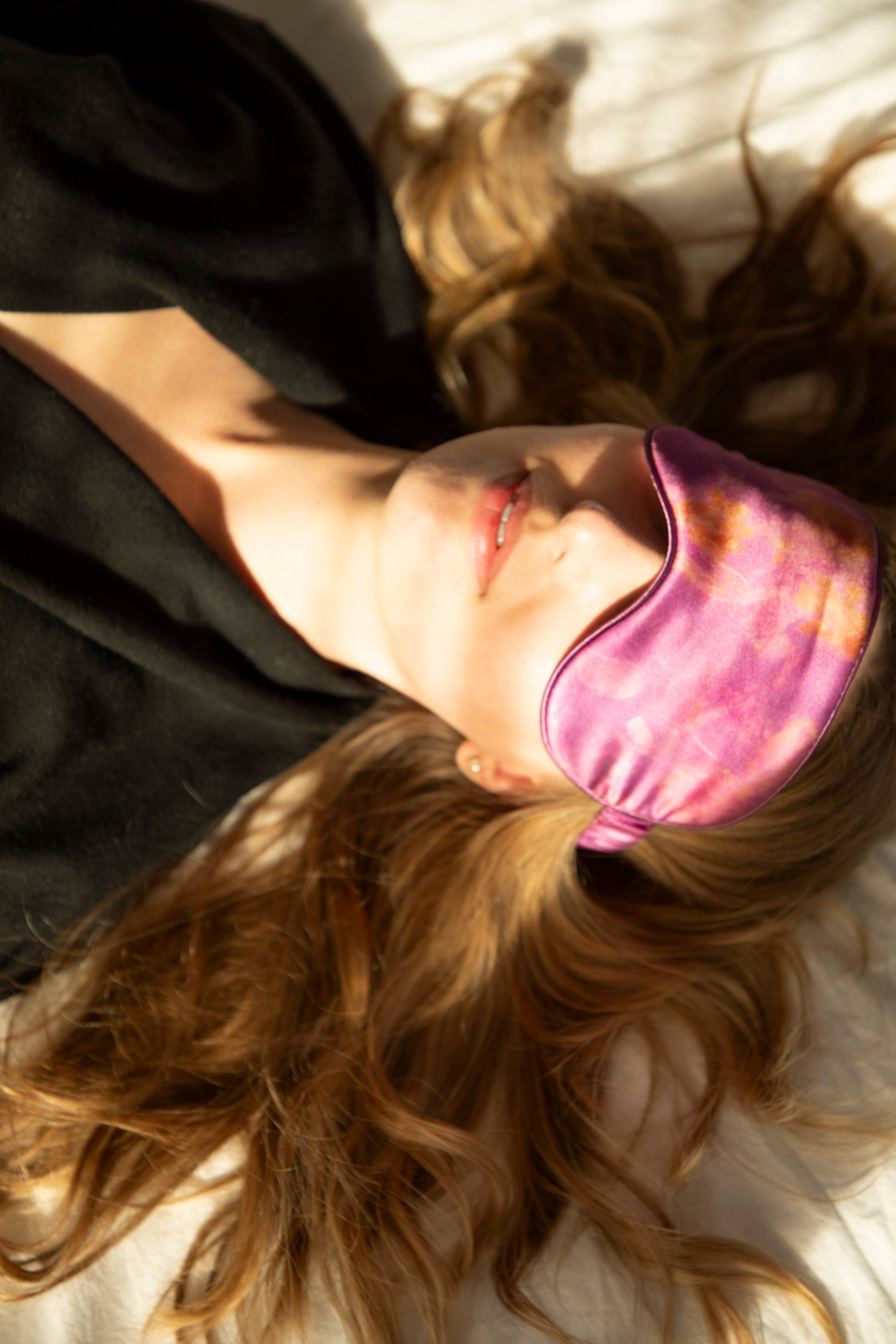 chic aesthetic with model sleeping with silk and willow restorative silk sleep mask. 