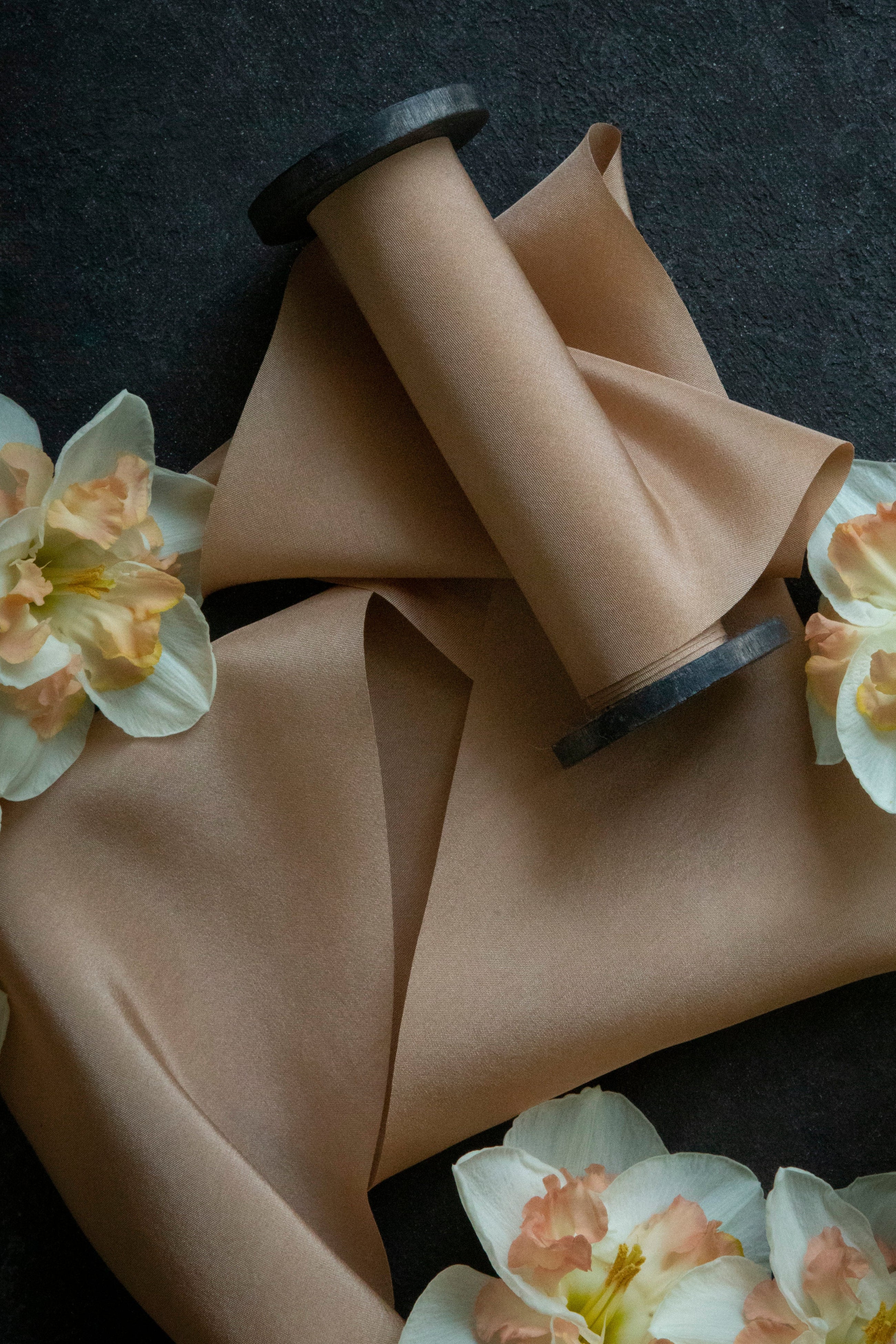 coral ribbon against black background