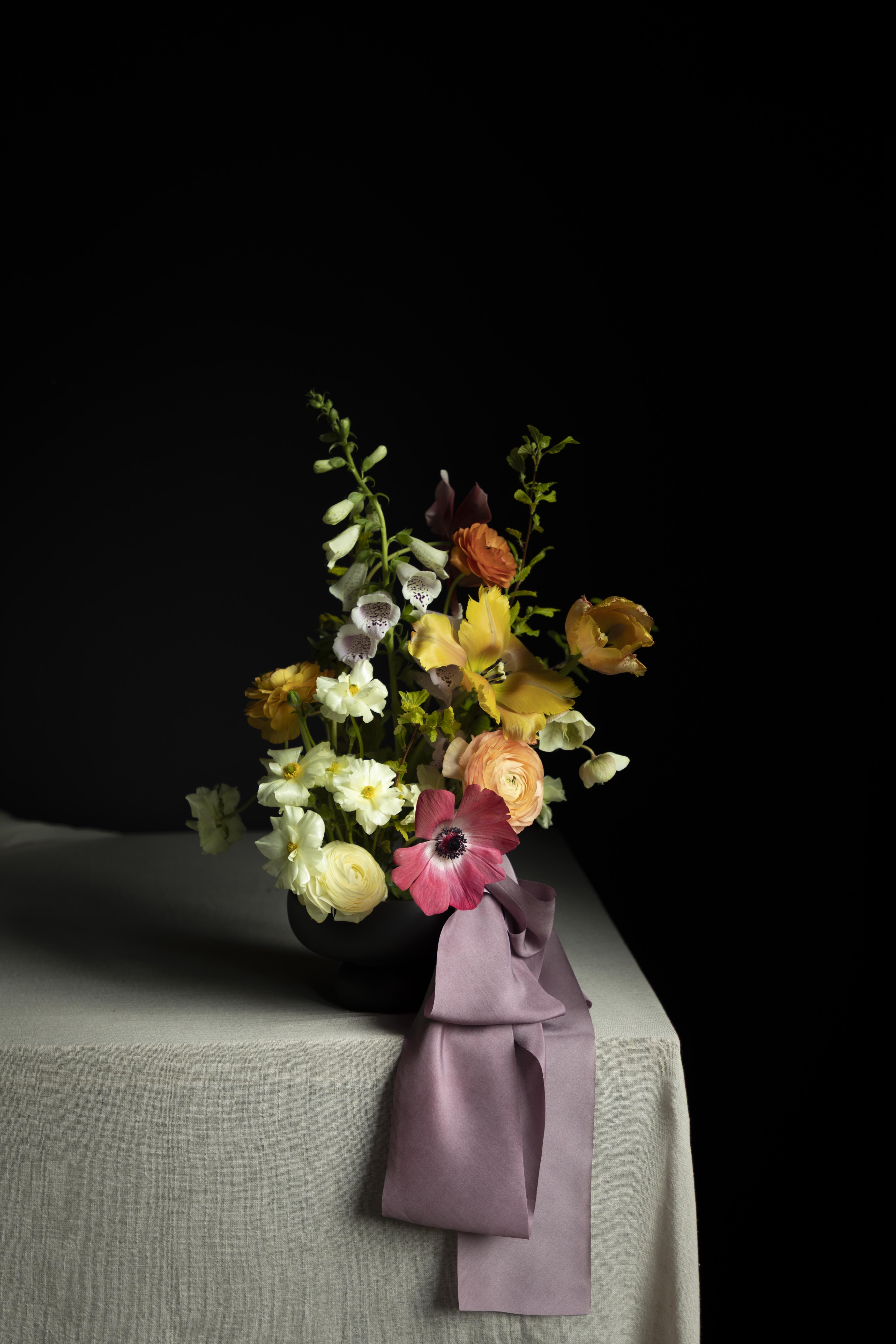 wedding flower arrangement with purple silk ribbon display