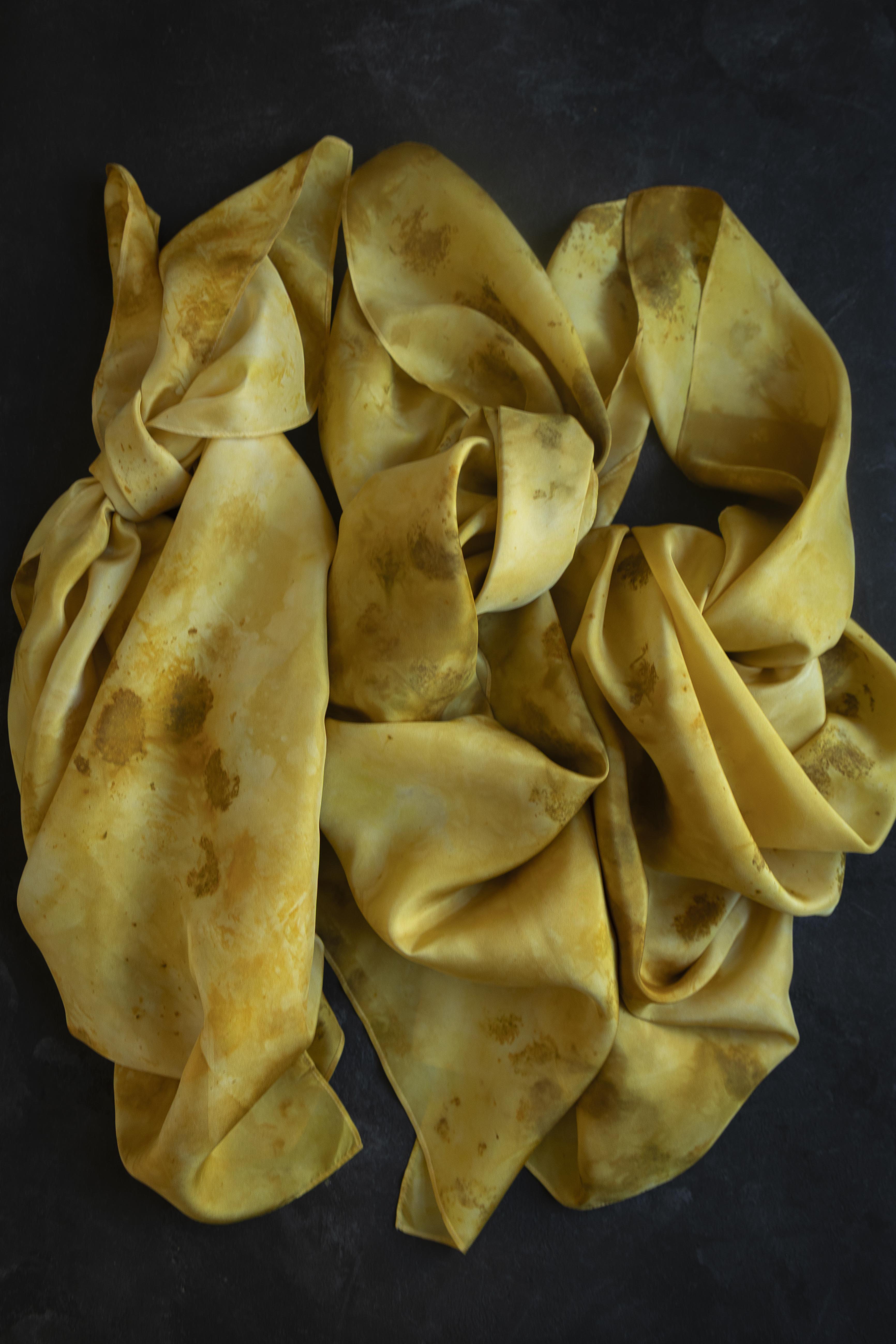 Yellow fabric scrunchie on a dark background
