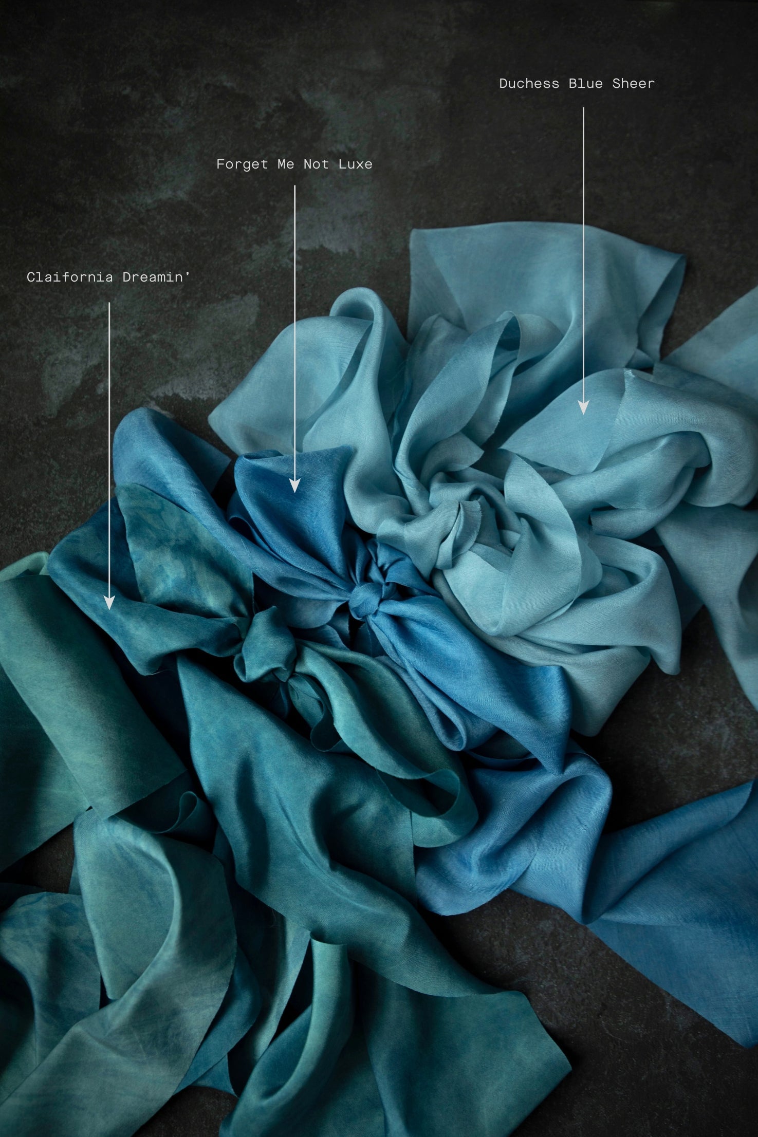 indigo dyed Blue ribbon swatches arranged on a dark background