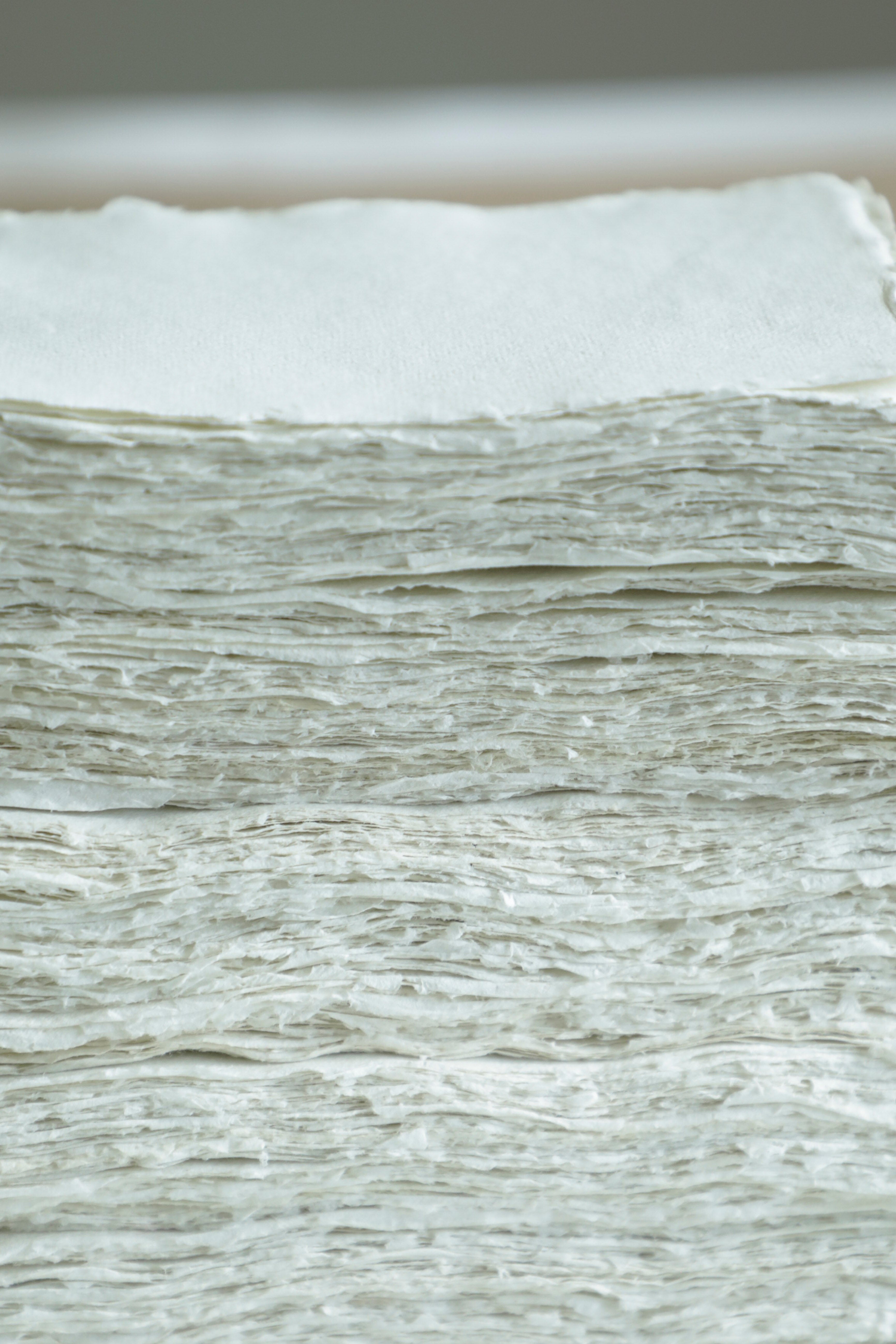 Close-up of a stack of white paper sheets