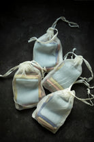 silk ribbons in a silk bag on black background
