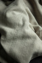 Close-up of textured gray fabric with folds