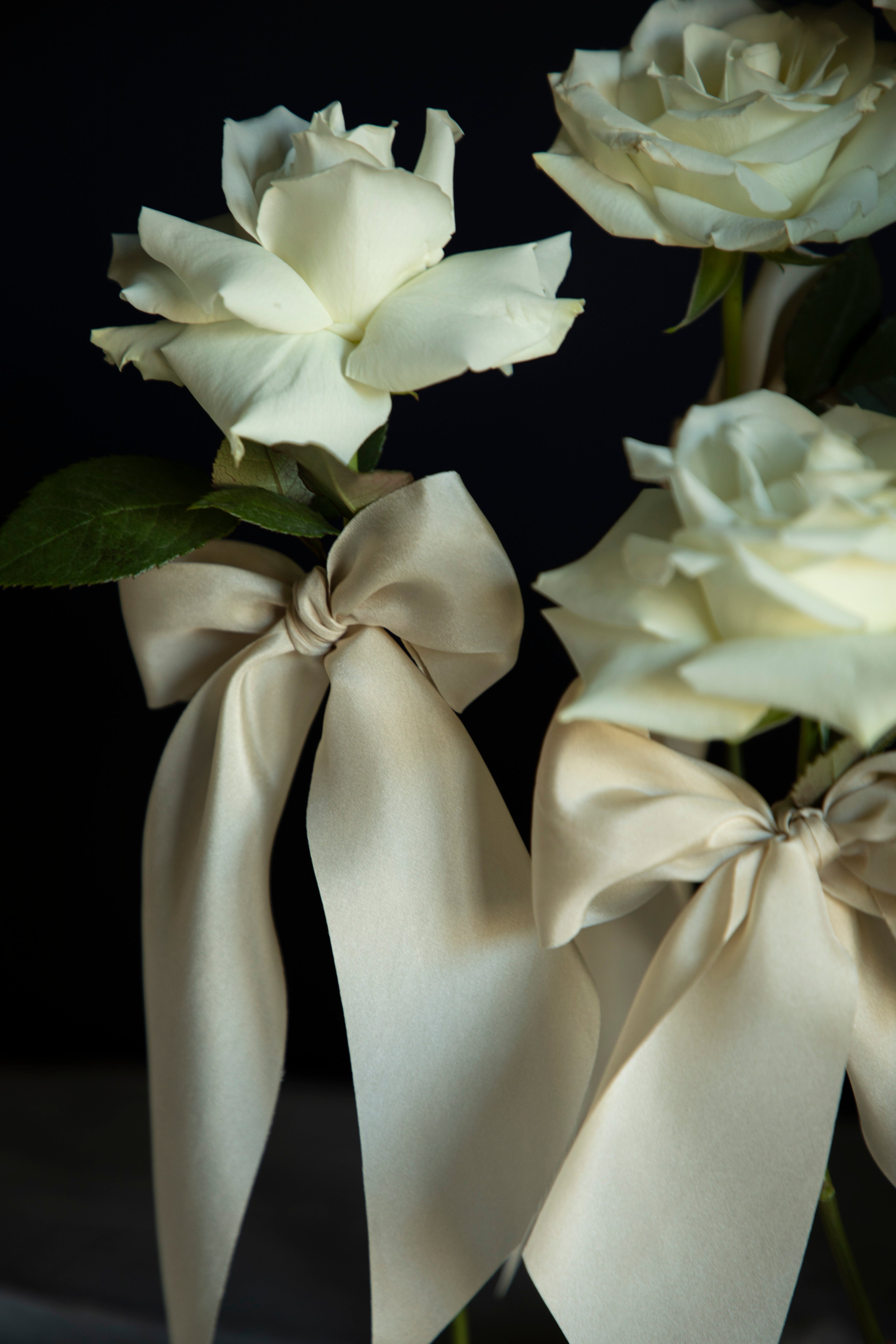 white roses with silk ribbons wedding centerpiece