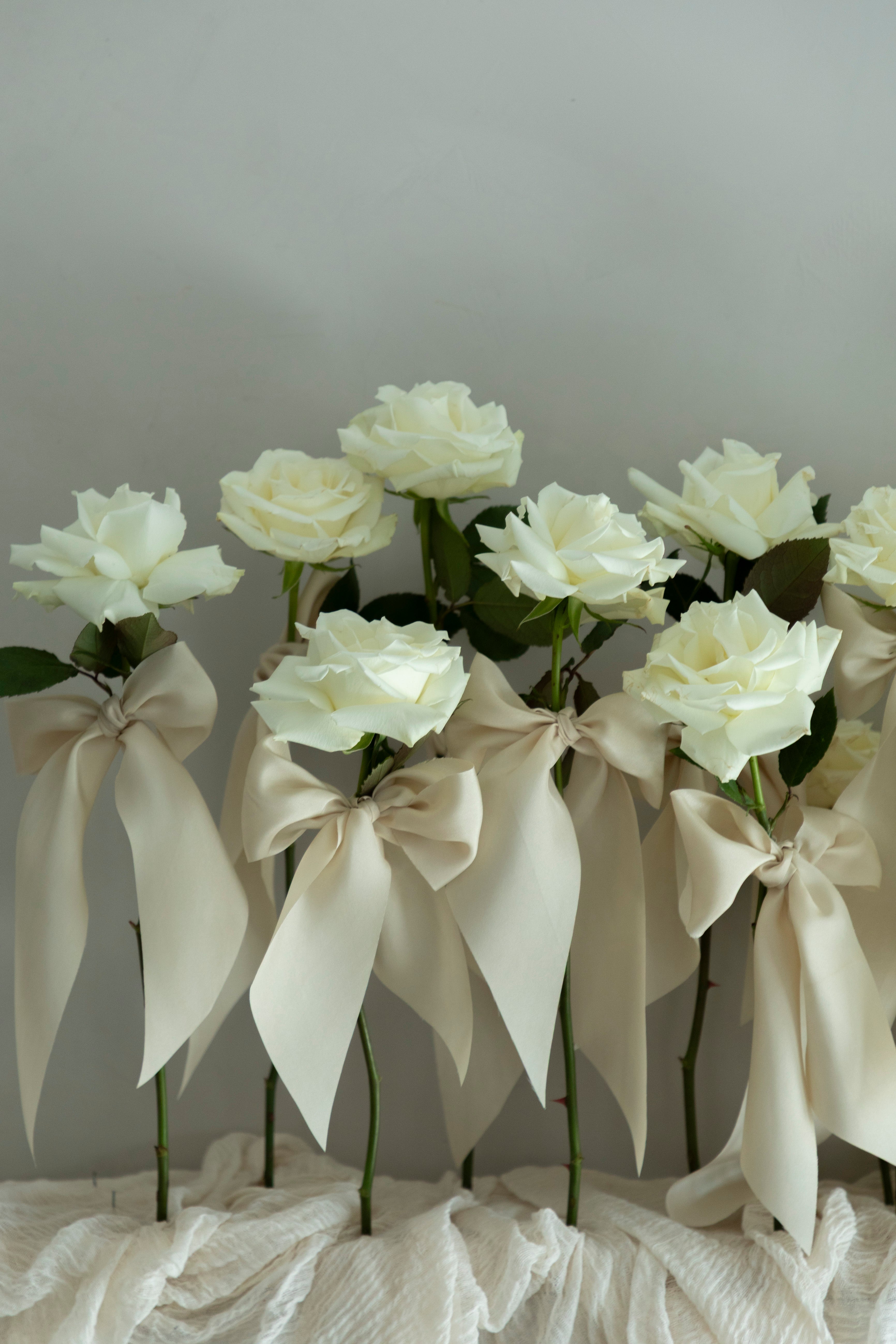 white roses with silk ribbons wedding centerpiece