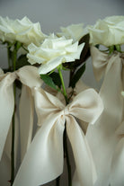 white roses with silk ribbons, unique wedding display