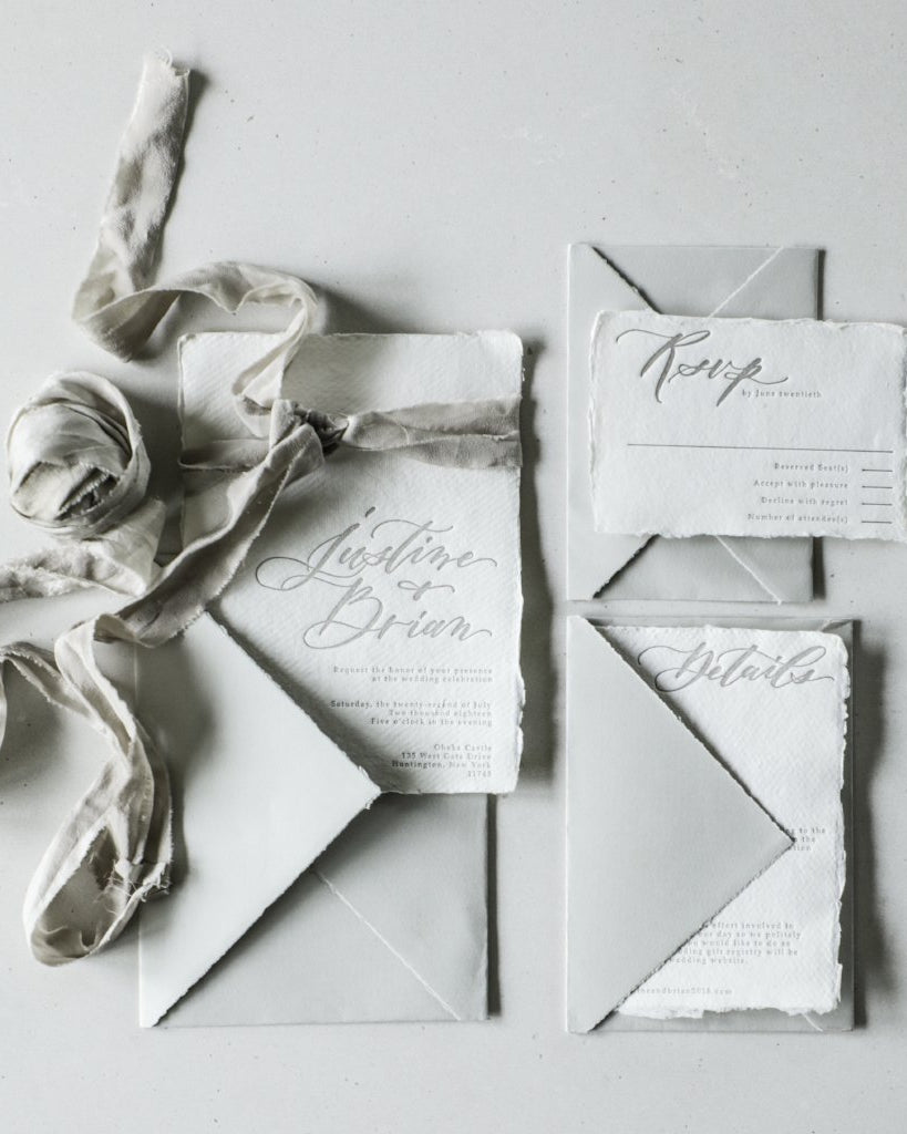 custom wedding invitations on silk and willow handmade paper with gray arpa envelopes and silk ribbon