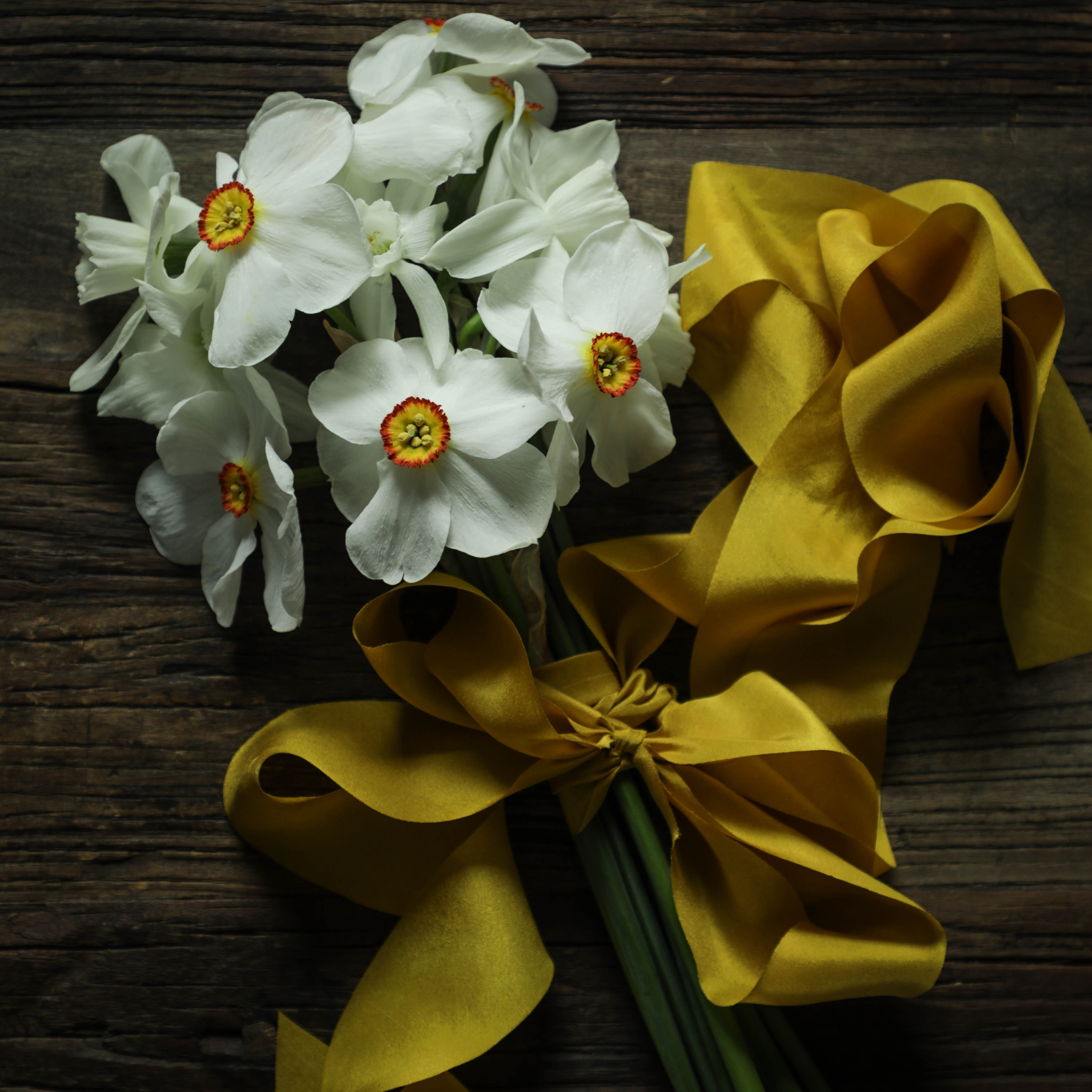daffodil flower bouquet with yellow ribbon. Ideal for wrapping bridal bouquets, this ribbon is perfect for brides-to-be, engaged couples, and florists looking to add a touch of sophistication to wedding arrangements.