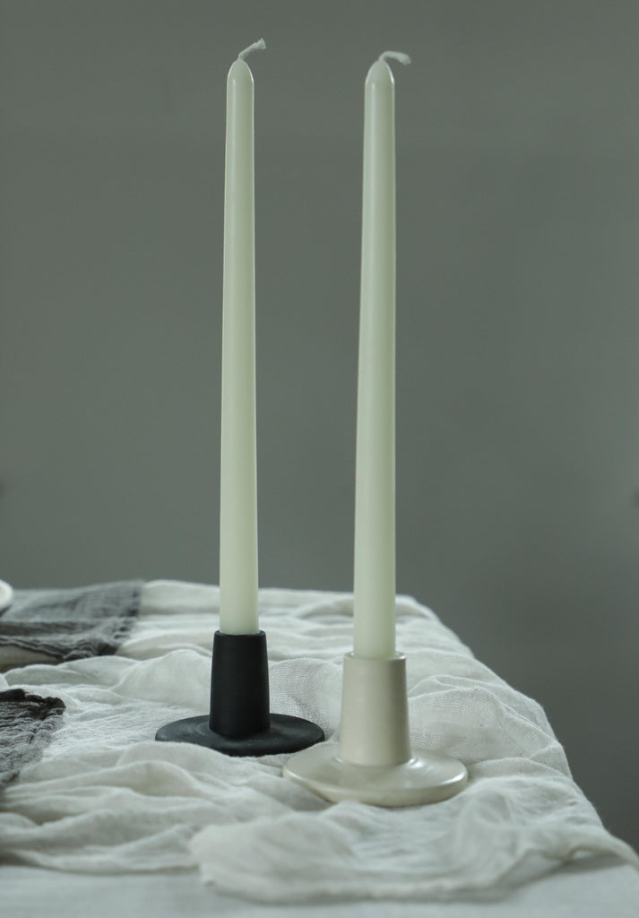 matte black and satin white candle holders with beeswax candles