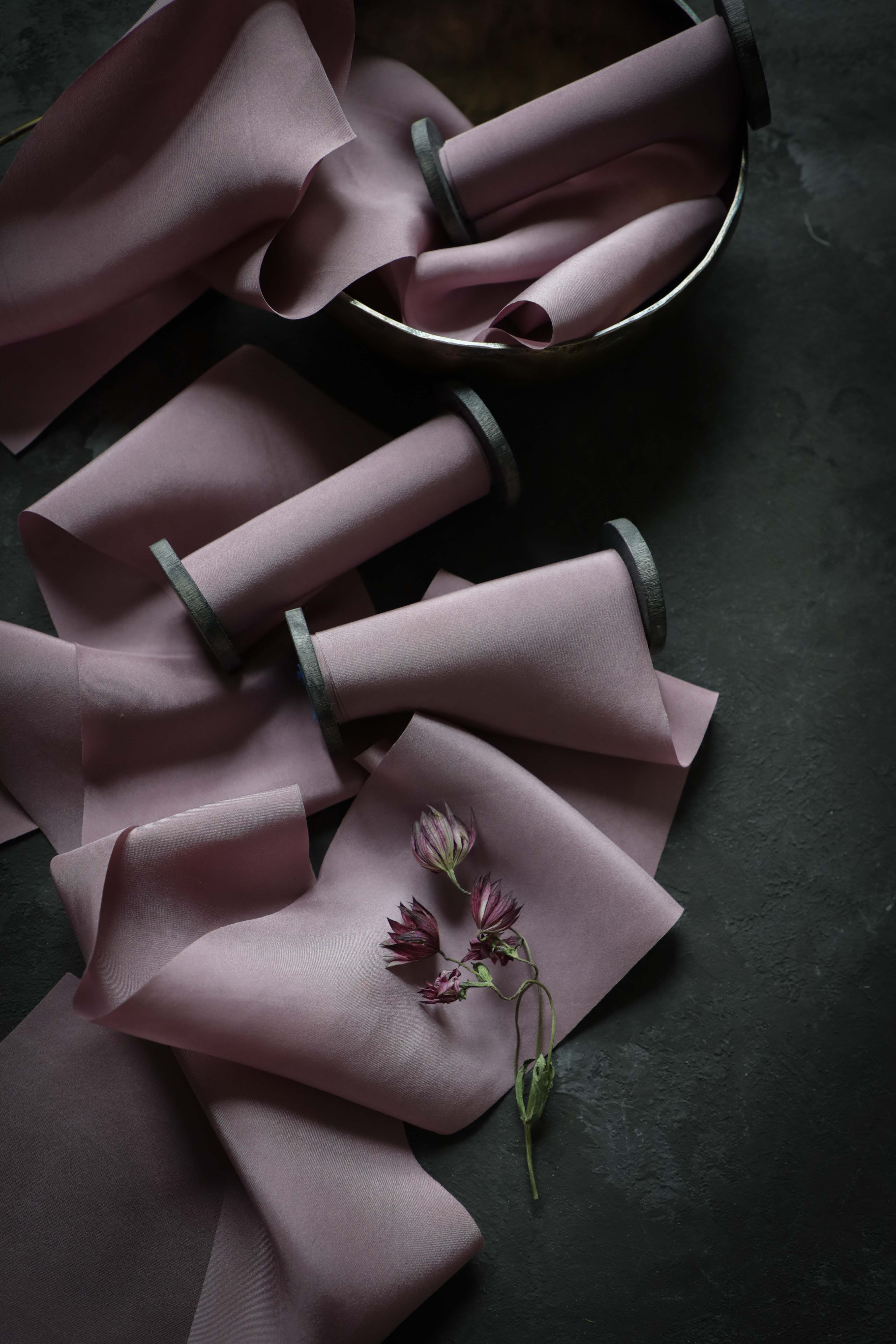 purple silk ribbon on antique wood spool