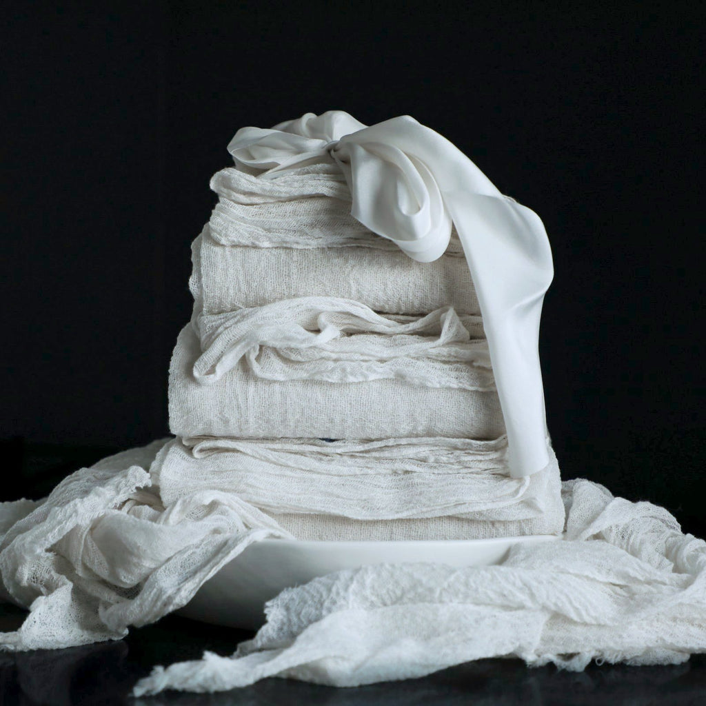 Display of Antique White guazy table linens