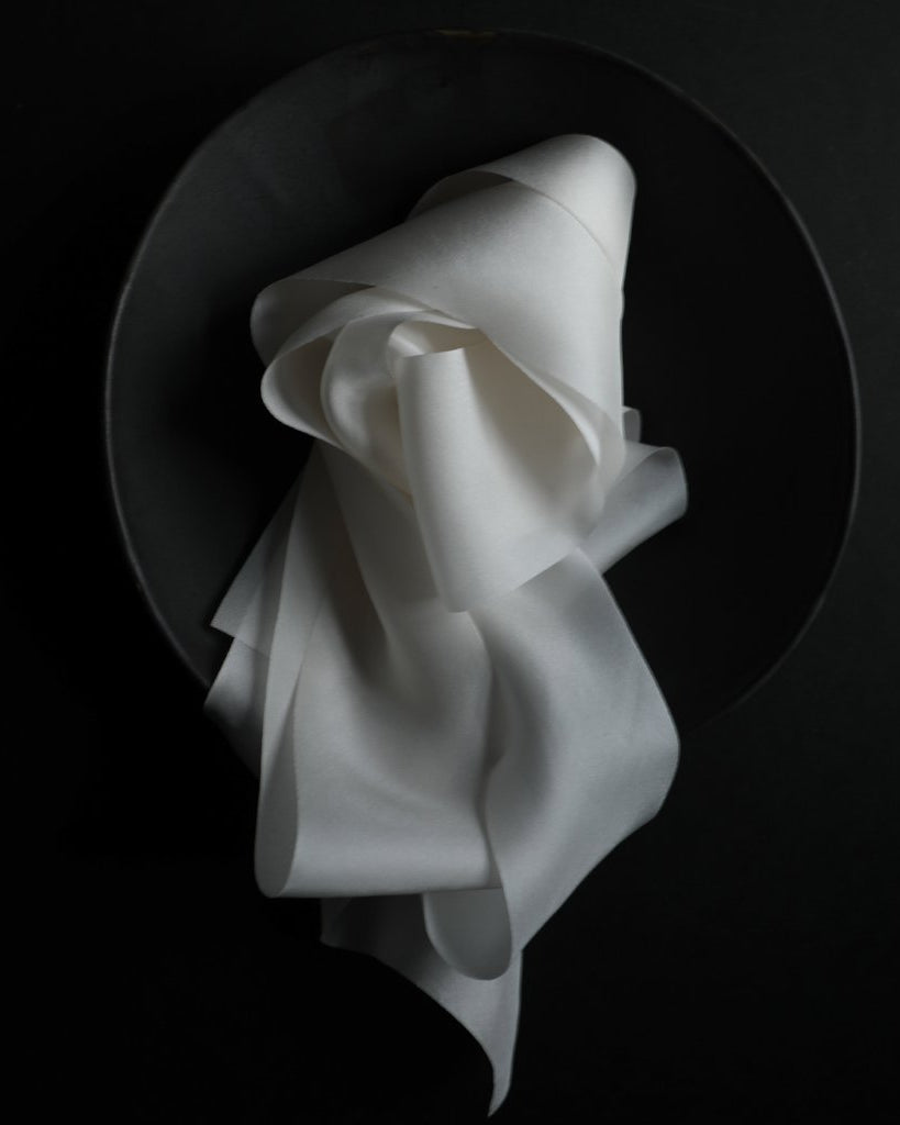 Antique White silk ribbon displayed in a bowl
