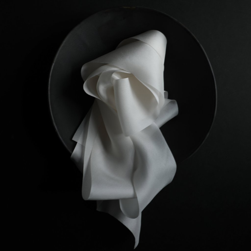Antique White silk ribbon displayed in a bowl