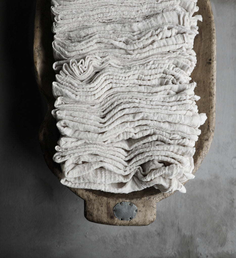 silk and willow hand-loomed napkins in antique wooden bowl