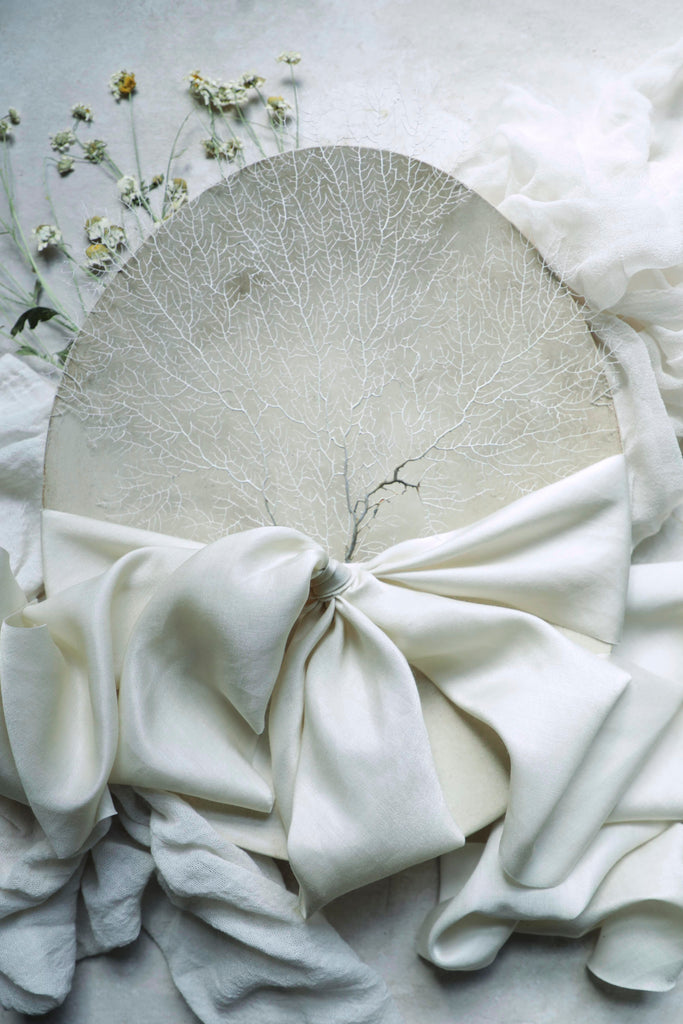 silk and willow wedding flat lay styling with silk ribbon and handmade ceramics