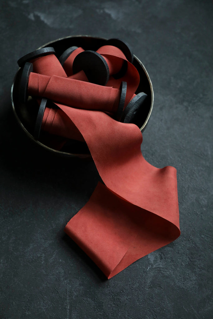 red color silk ribbon in brass bowl