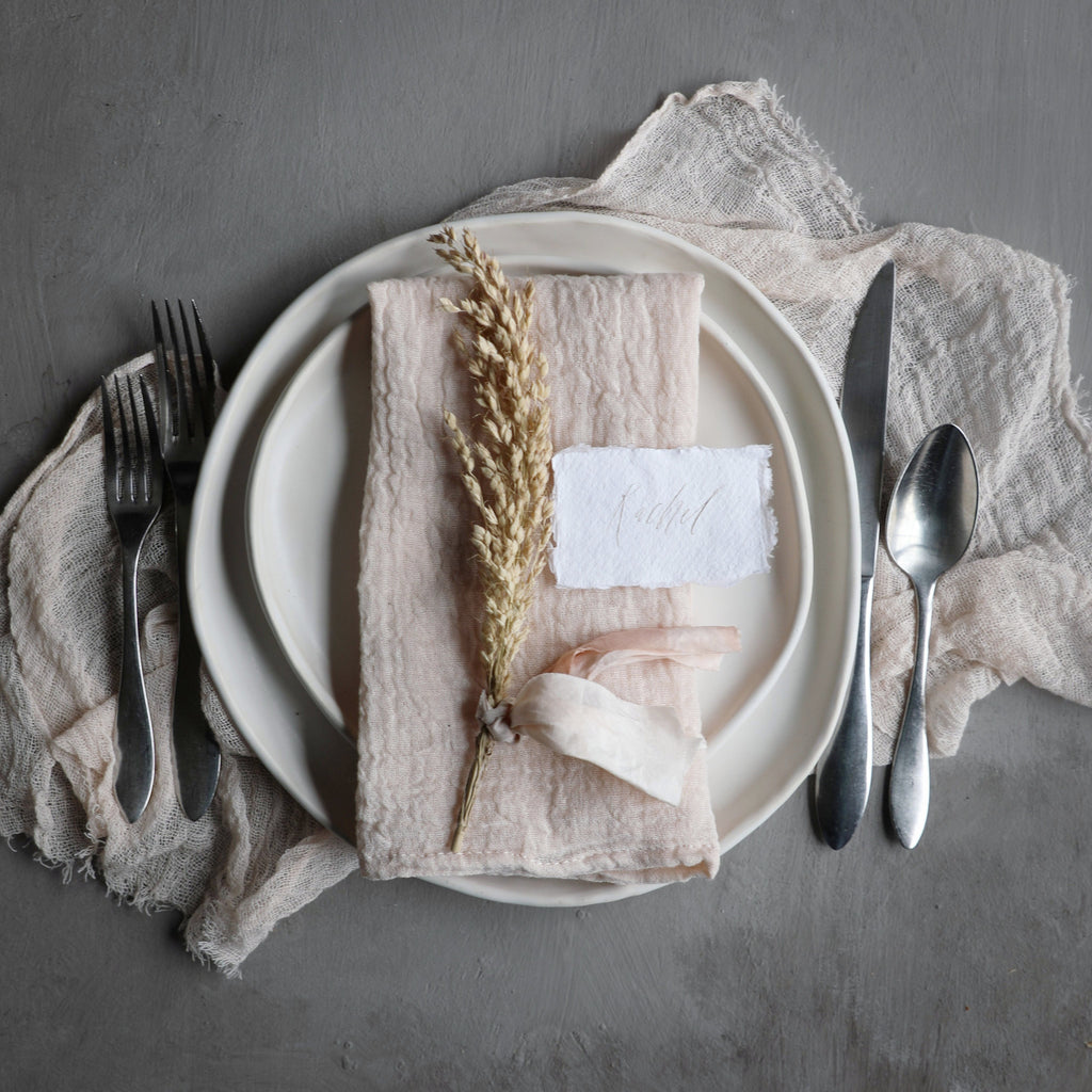 Example of a place setting idea with Silk and Willow Hand-loomed cotton napkins and handmade ceramic plates