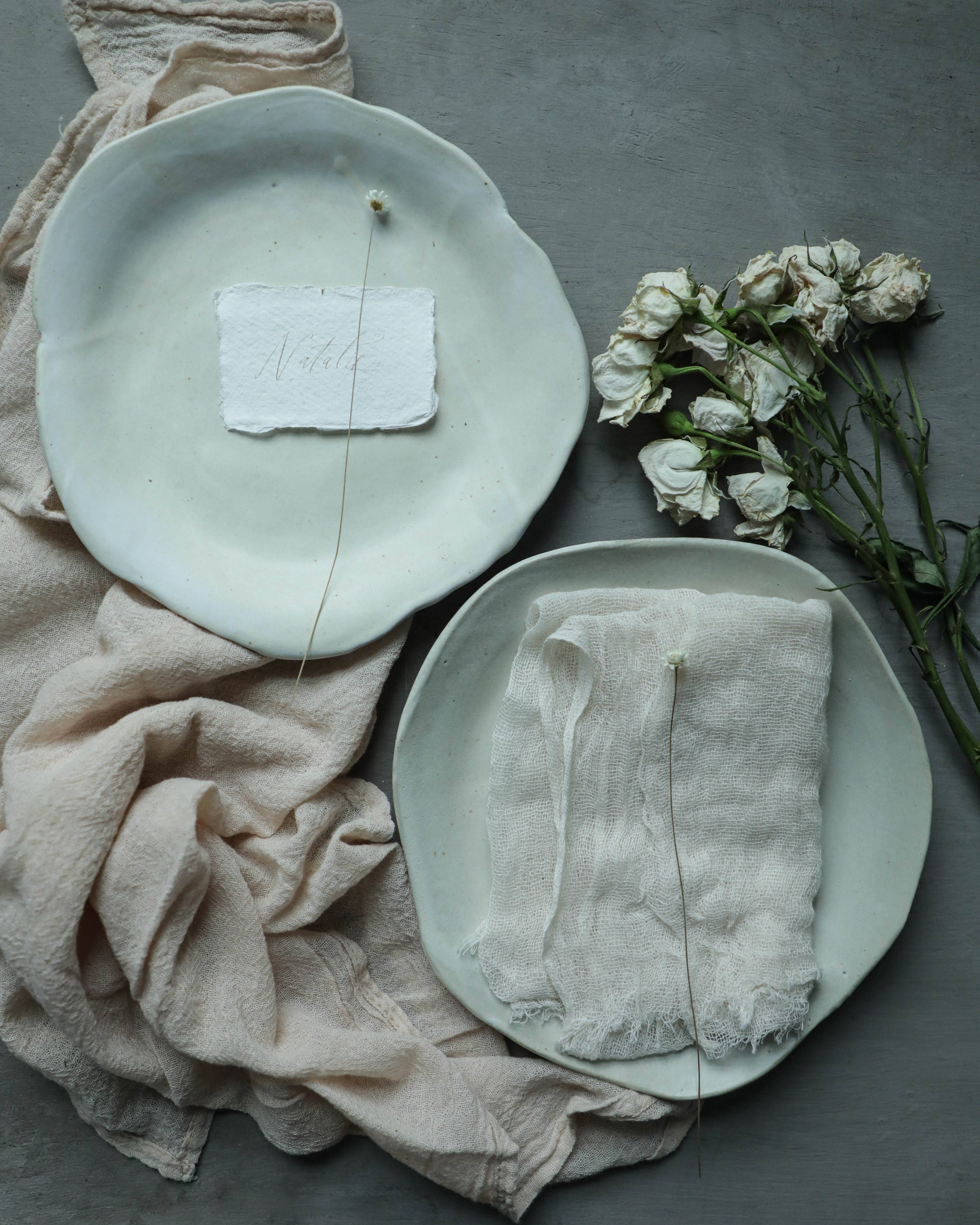 handmade ceramic plates styled with Silk and Willow napkins for a romantic wedding feel
