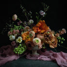 wedding floral centerpiece with sheer silk runner