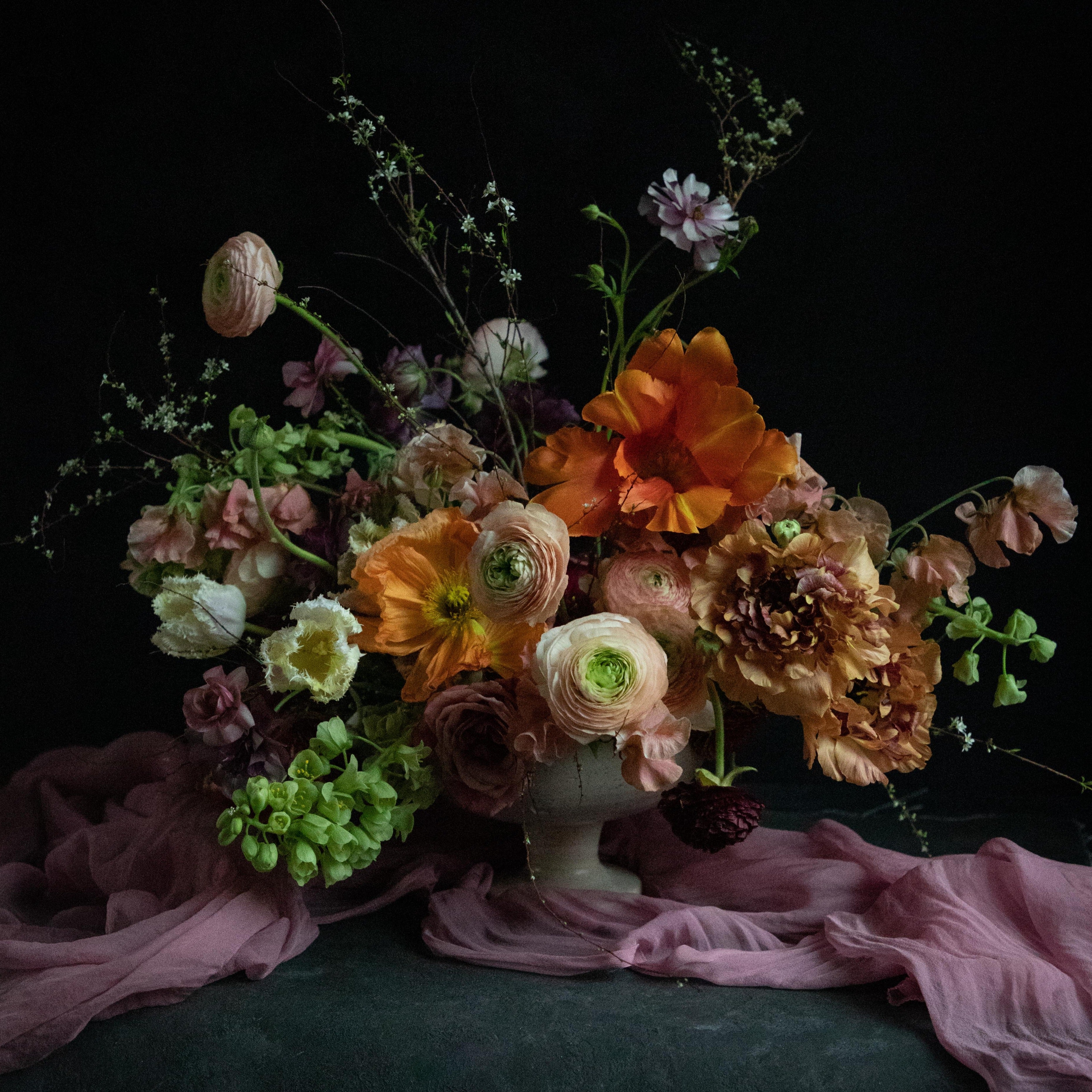 wedding floral centerpiece with sheer silk runner