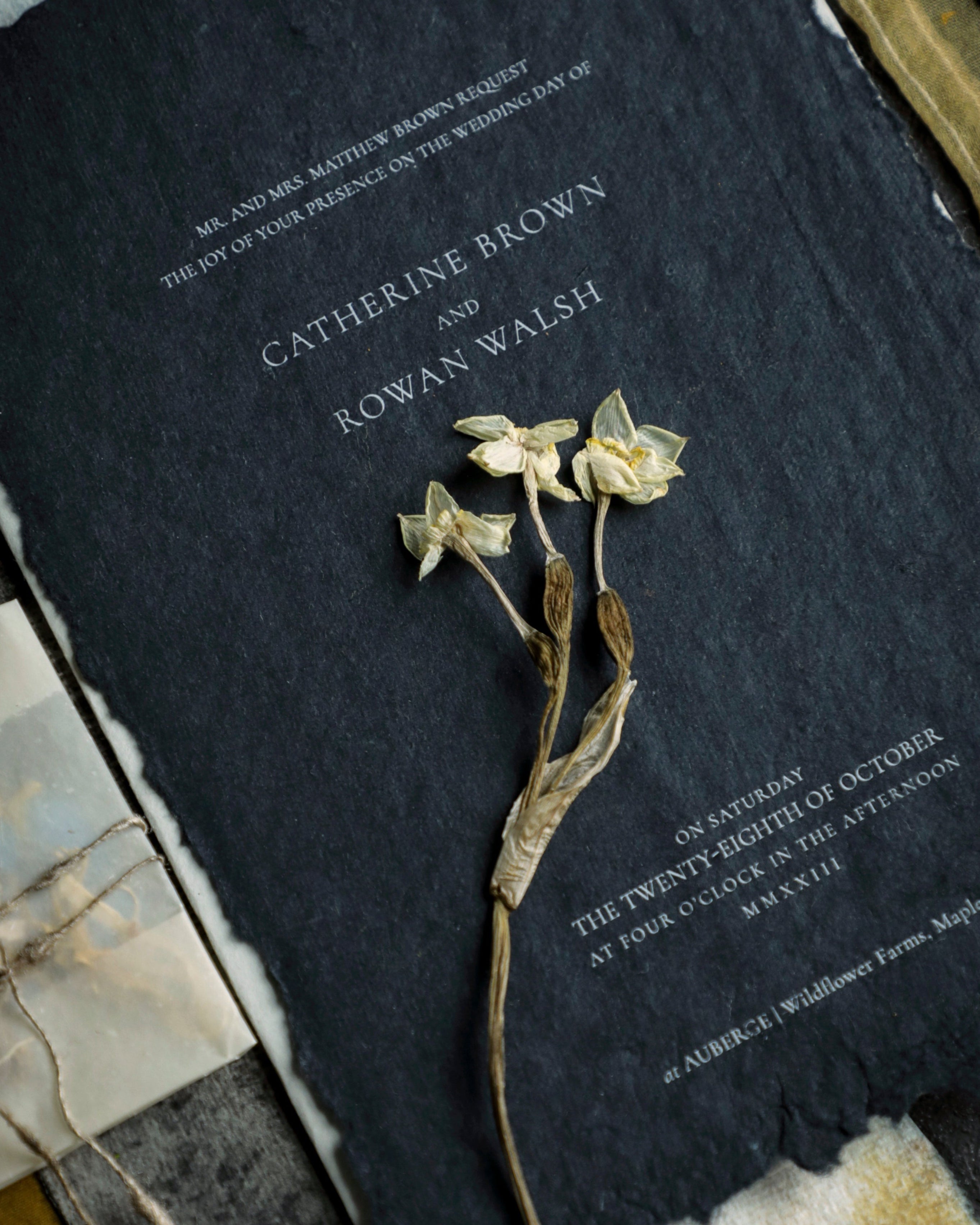 black handmade paper by silk and willow with white ink toner. DIY wedding invitations