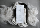 silk and willow antique white sheer silk table runner with antique white napkin and custom menu on handmade paper