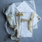 custom wedding invitations on handmade deckled edge paper  and gold silk ribbon. silk and willow silk ribbons